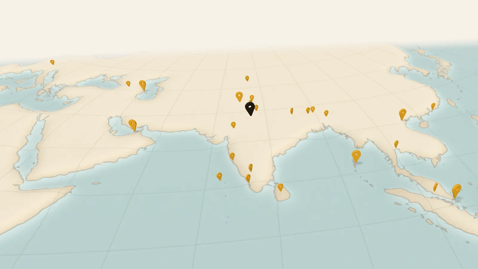 A paper relief map of Asia with marigold map pins standing on it and a dashed line running out from Gurugram