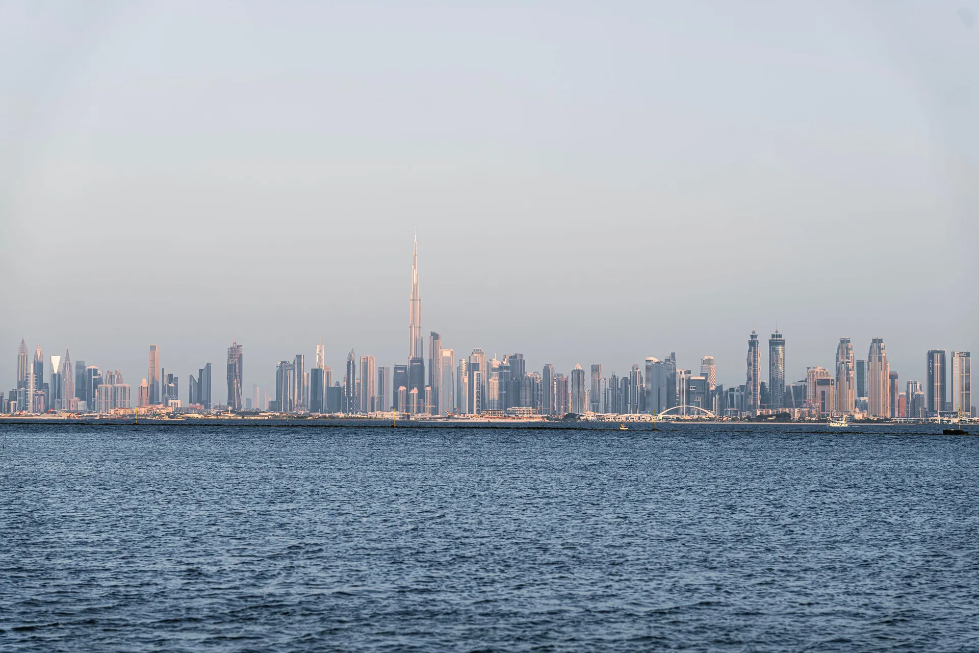 A stunning view of Dubai's skyline featuring Burj Khalifa across the sea.