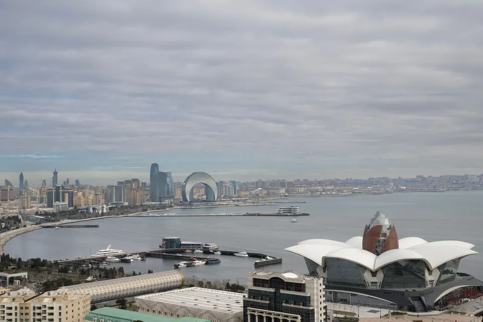 Scenic aerial view of Baku, Azerbaijan overlooking the Caspian Sea with iconic architecture and urban landscape.