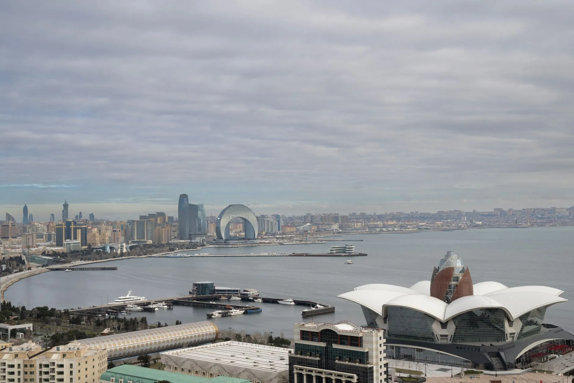 Scenic aerial view of Baku, Azerbaijan overlooking the Caspian Sea with iconic architecture and urban landscape.