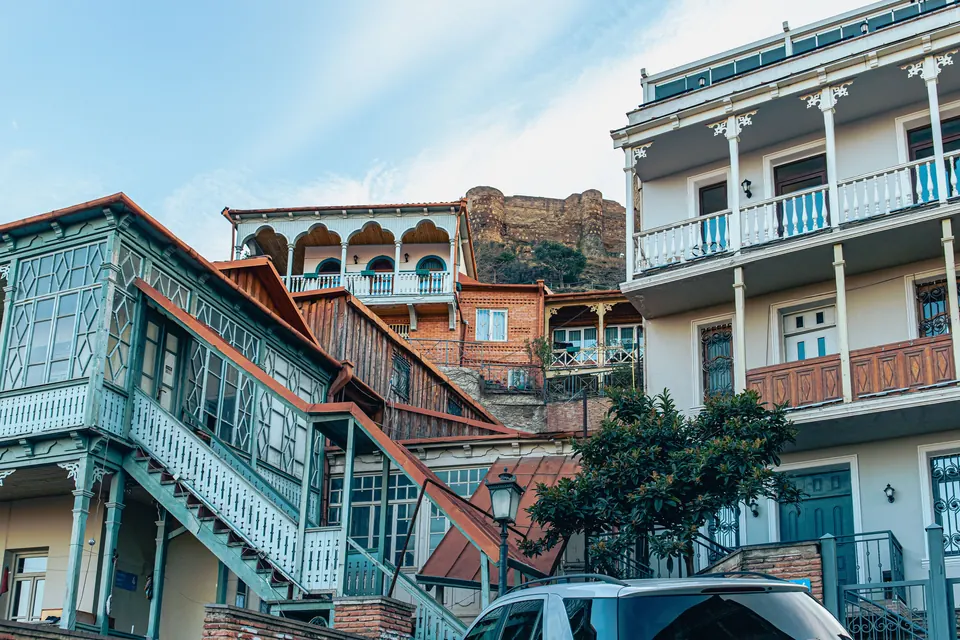 Traditional Tbilisi houses with ornate balconies showcasing classic Georgian architecture.