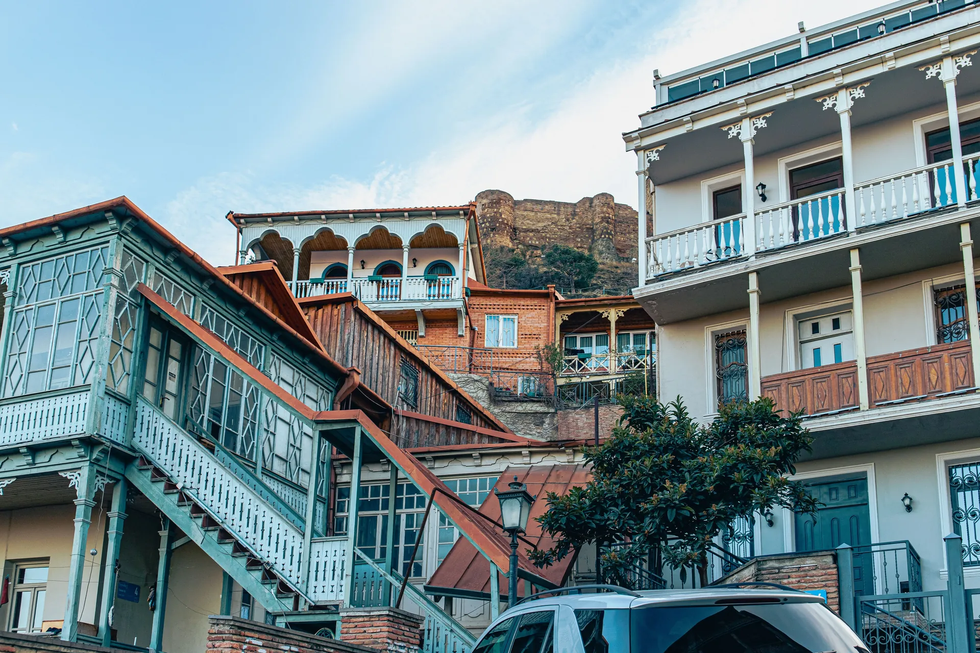 Traditional Tbilisi houses with ornate balconies showcasing classic Georgian architecture.