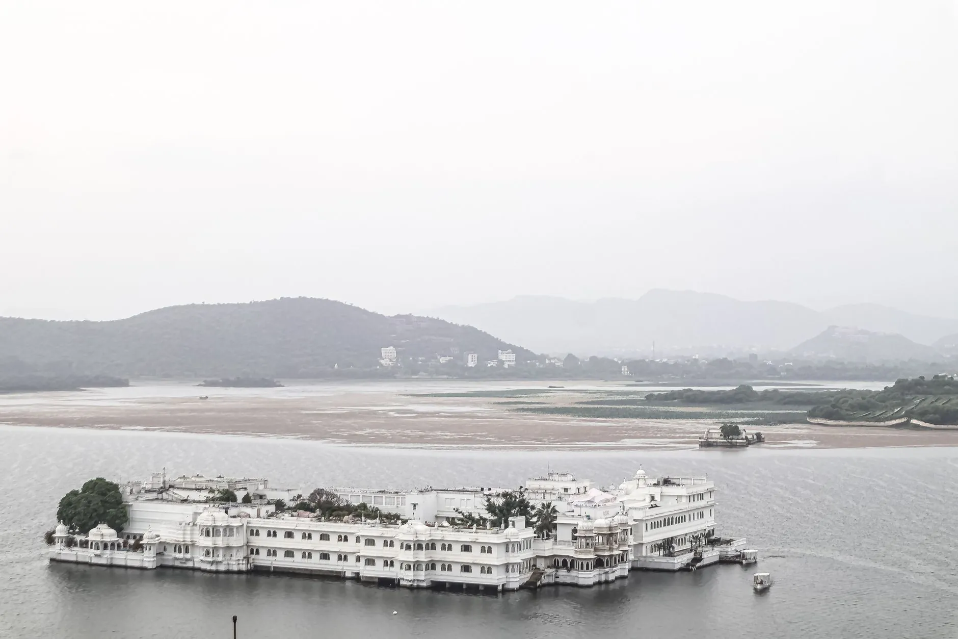 A serene view of the famous Lake Palace on Lake Pichola in Udaipur, India.