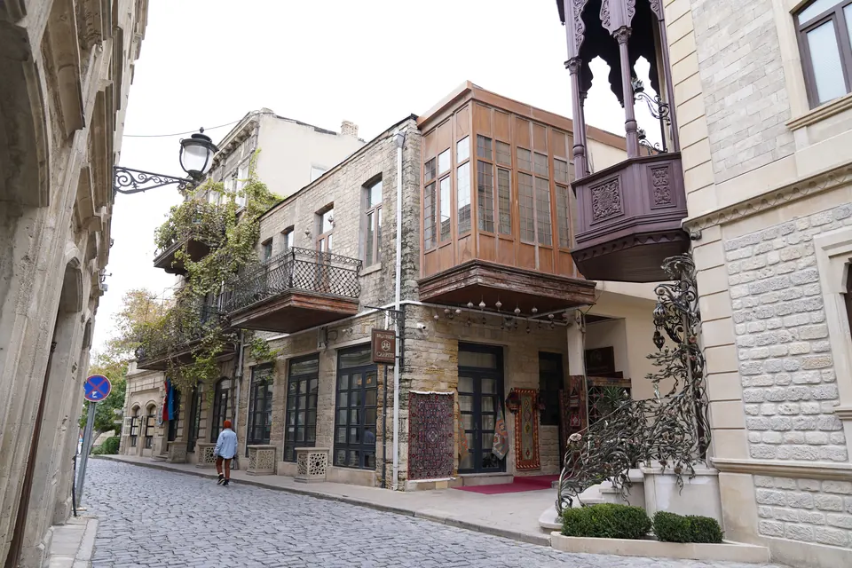 Traditional architecture and cobblestone street in the historic Old City of Baku, Azerbaijan.
