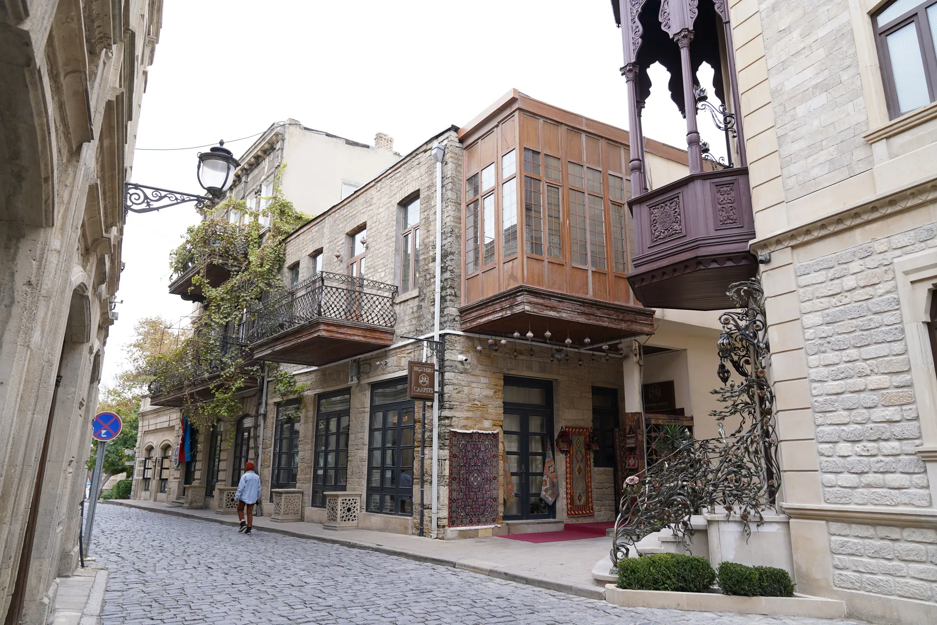 Traditional architecture and cobblestone street in the historic Old City of Baku, Azerbaijan.