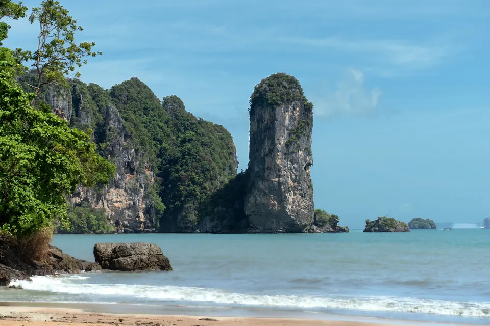 Majestic limestone cliffs and blue sea at Ao Nang Beach, Krabi, perfect for tropical travel inspiration.