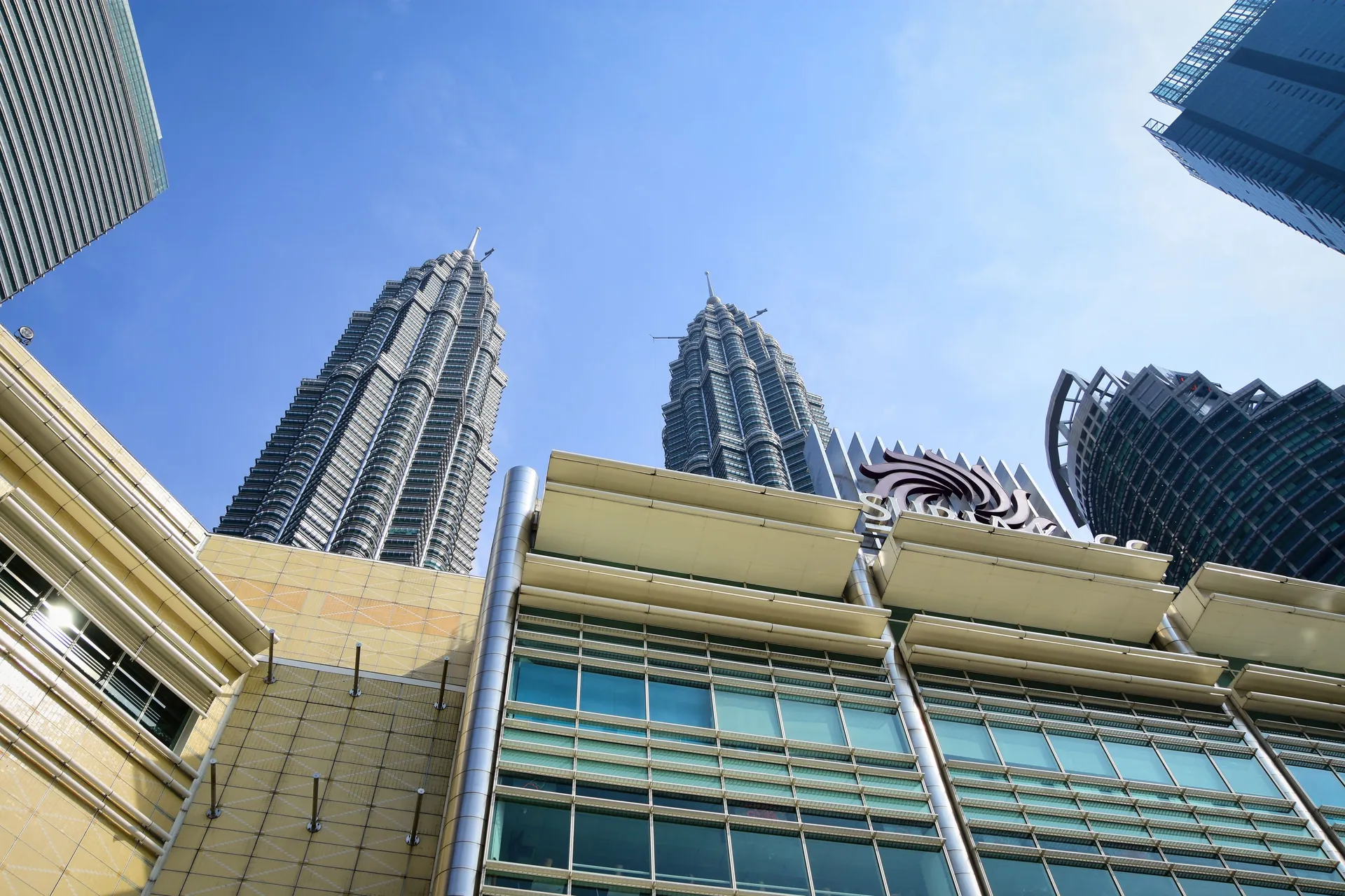 Stunning view of Petronas Towers from the streets of Kuala Lumpur, Malaysia.