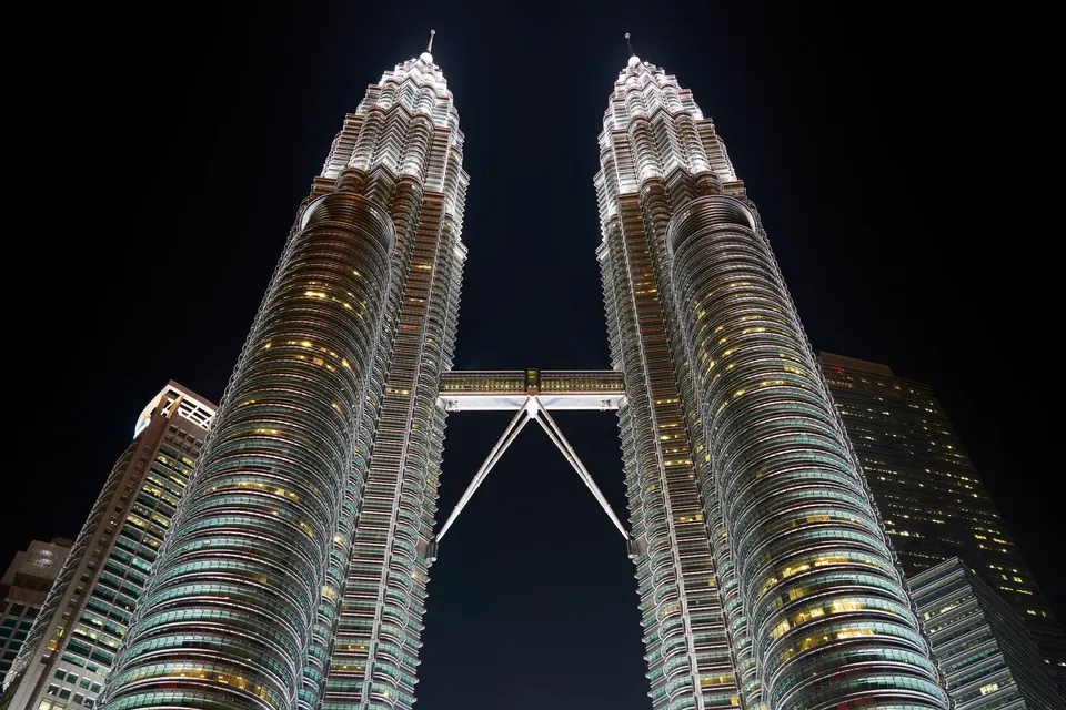 Magnificent view of Petronas Twin Towers in Kuala Lumpur, Malaysia at night.